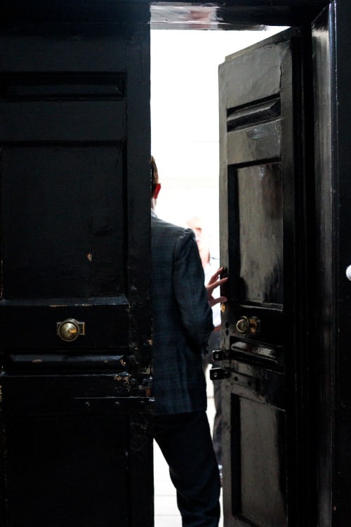 boy opening door