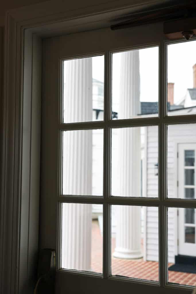 windowed door looking out on columns