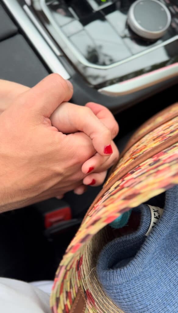 holding hands in the car